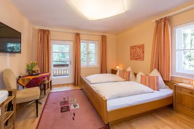 Ein Bett oder Betten in einem Zimmer der Unterkunft MEINE HEIMAT - Apartments in Ramsau am Dachstein - inklusive SOMMERCARD