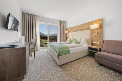 Ein Bett oder Betten in einem Zimmer der Unterkunft Landhotel Berger