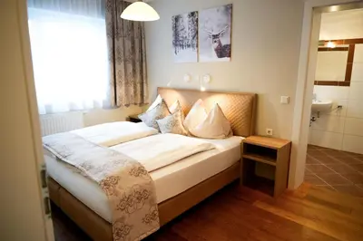 Ein Bett oder Betten in einem Zimmer der Unterkunft Landhotel Berger