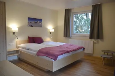 Ein Bett oder Betten in einem Zimmer der Unterkunft Pension Adlerhorst