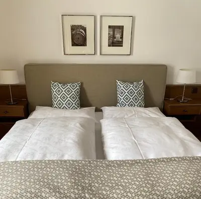 Ein Bett oder Betten in einem Zimmer der Unterkunft Ferienwohnungen Rettenbacher