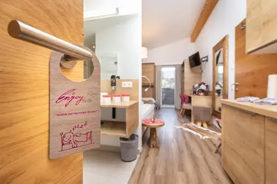 Ein Bett oder Betten in einem Zimmer der Unterkunft Enjoy The Alps - Aparthotel