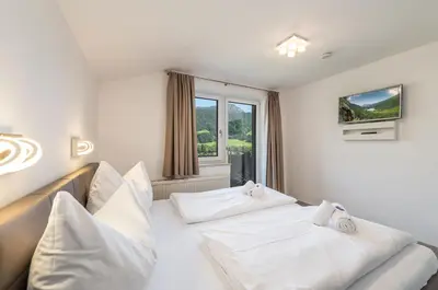Ein Bett oder Betten in einem Zimmer der Unterkunft Mountain Love Appartements - by myNests