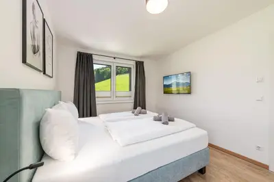 Ein Bett oder Betten in einem Zimmer der Unterkunft Mountain Love Appartements - by myNests