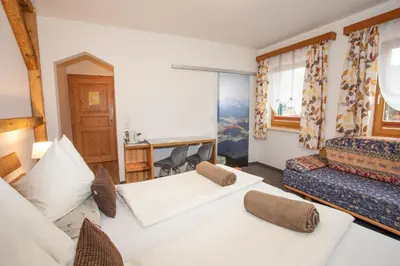Ein Bett oder Betten in einem Zimmer der Unterkunft Gästehaus Fuchs