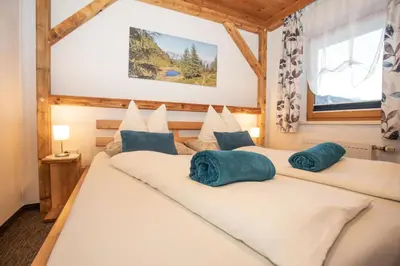 Ein Bett oder Betten in einem Zimmer der Unterkunft Gästehaus Fuchs