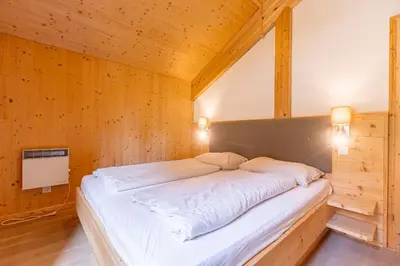 Ein Bett oder Betten in einem Zimmer der Unterkunft Alpenchalets Reiteralm by ALPS RESORTS