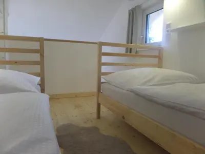 Ein Bett oder Betten in einem Zimmer der Unterkunft Ferienhaus Marianne