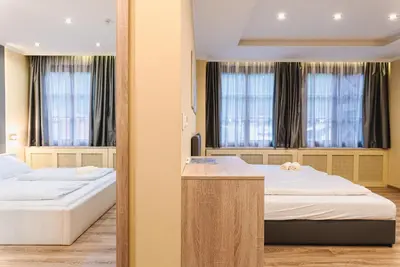 Ein Bett oder Betten in einem Zimmer der Unterkunft VillaJazz Apartments