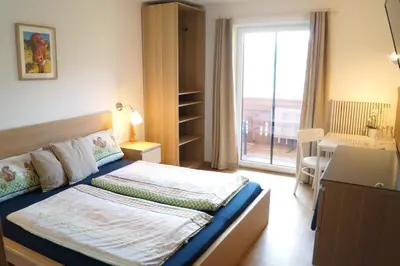 Ein Bett oder Betten in einem Zimmer der Unterkunft Sauschneidhof - Radstadt