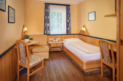 Ein Bett oder Betten in einem Zimmer der Unterkunft Hotel Hubertushof