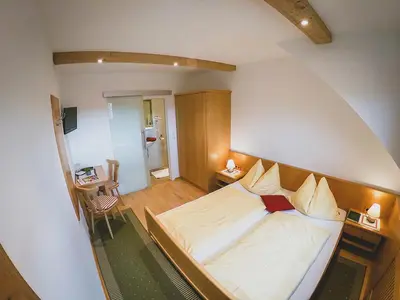 Ein Bett oder Betten in einem Zimmer der Unterkunft Appartements Macheiner