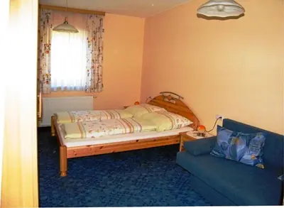 Ein Bett oder Betten in einem Zimmer der Unterkunft Tremlhof