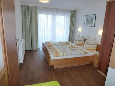 Ein Bett oder Betten in einem Zimmer der Unterkunft Ferienhaus u. Appartement Knauss
