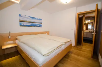 Ein Bett oder Betten in einem Zimmer der Unterkunft Ferienwohnungen Flattnerhof