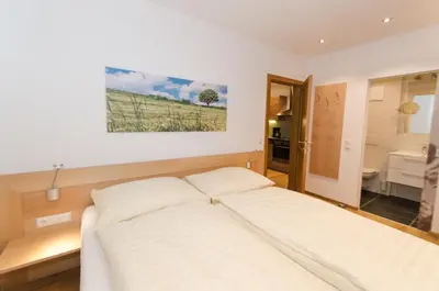 Ein Bett oder Betten in einem Zimmer der Unterkunft Ferienwohnungen Flattnerhof