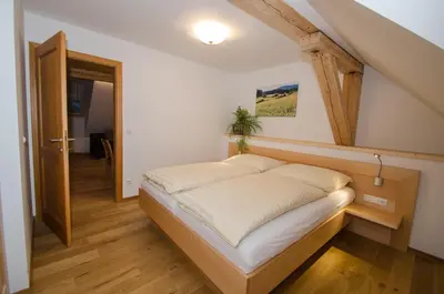 Ein Bett oder Betten in einem Zimmer der Unterkunft Ferienwohnungen Flattnerhof