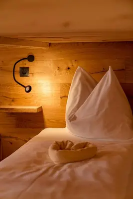 Ein Bett oder Betten in einem Zimmer der Unterkunft Das kleine Bio Hotel Tiefenbach