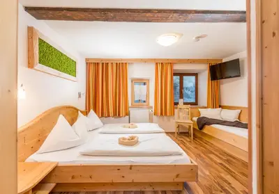 Ein Bett oder Betten in einem Zimmer der Unterkunft Das kleine Bio Hotel Tiefenbach