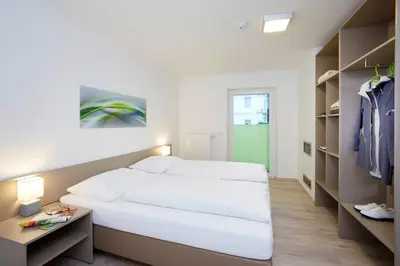 Ein Bett oder Betten in einem Zimmer der Unterkunft Good Rooms GmbH Bad Ischl