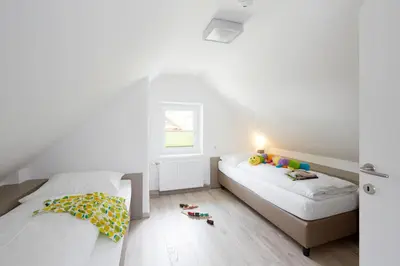 Ein Bett oder Betten in einem Zimmer der Unterkunft Good Rooms GmbH Bad Ischl