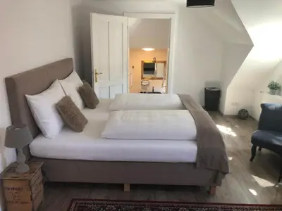 Ein Bett oder Betten in einem Zimmer der Unterkunft Fenix Hall Boutique Hotel Hallstatt