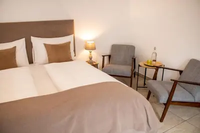 Ein Bett oder Betten in einem Zimmer der Unterkunft Fenix Hall Boutique Hotel Hallstatt