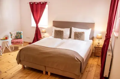 Ein Bett oder Betten in einem Zimmer der Unterkunft Fenix Hall Boutique Hotel Hallstatt