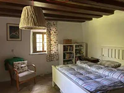 Ein Bett oder Betten in einem Zimmer der Unterkunft Kainzenhof 1690