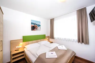 Ein Bett oder Betten in einem Zimmer der Unterkunft Apart Jasmin