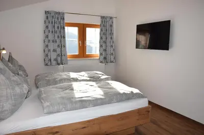 Ein Bett oder Betten in einem Zimmer der Unterkunft Gasthof Pension Hetzenbichl