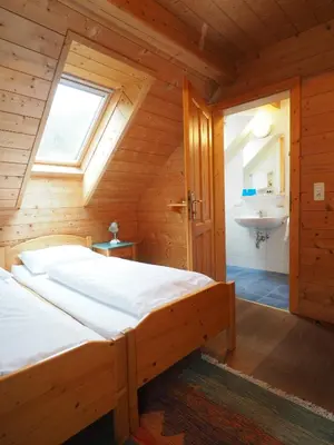 Ein Bett oder Betten in einem Zimmer der Unterkunft Haus Helene im Öko-Feriendorf