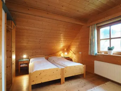 Ein Bett oder Betten in einem Zimmer der Unterkunft Haus Helene im Öko-Feriendorf