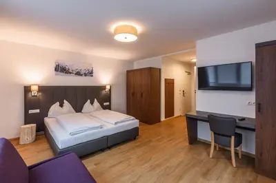 Ein Bett oder Betten in einem Zimmer der Unterkunft Haus Hubertus