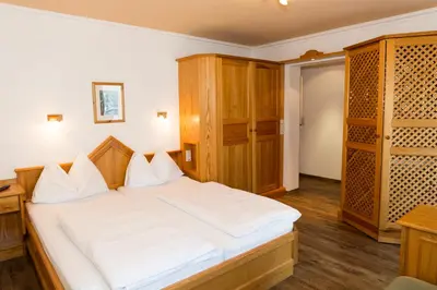 Ein Bett oder Betten in einem Zimmer der Unterkunft Haus Hubertus