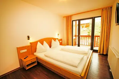 Ein Bett oder Betten in einem Zimmer der Unterkunft Haus Hubertus