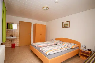 Ein Bett oder Betten in einem Zimmer der Unterkunft Haus Straubinger-Tiefenbacher
