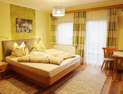 Ein Bett oder Betten in einem Zimmer der Unterkunft Haufhof-Pension am Bauernhof, Haus im Ennstal bei Schladming
