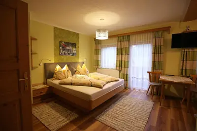 Ein Bett oder Betten in einem Zimmer der Unterkunft Haufhof-Pension am Bauernhof, Haus im Ennstal bei Schladming