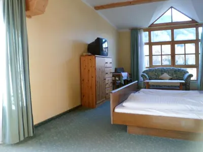 Ein Bett oder Betten in einem Zimmer der Unterkunft Pension Grünauhof