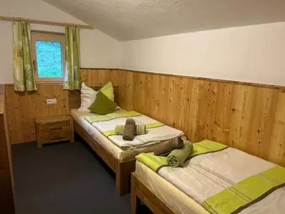 Ein Bett oder Betten in einem Zimmer der Unterkunft Flatzerhof