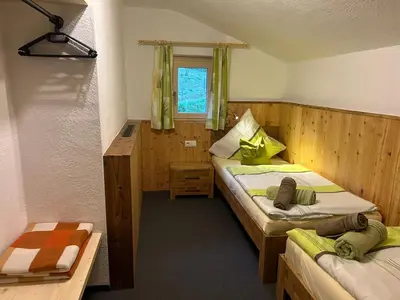 Ein Bett oder Betten in einem Zimmer der Unterkunft Flatzerhof