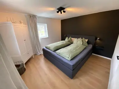 Ein Bett oder Betten in einem Zimmer der Unterkunft Tini House