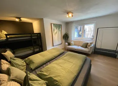 Ein Bett oder Betten in einem Zimmer der Unterkunft Tini House
