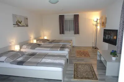 Ein Bett oder Betten in einem Zimmer der Unterkunft Gästehaus Daniela