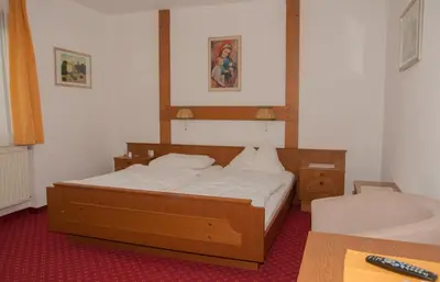 Ein Bett oder Betten in einem Zimmer der Unterkunft Gasthof Hofbauer