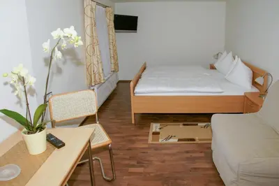 Ein Bett oder Betten in einem Zimmer der Unterkunft Gasthof Hofbauer