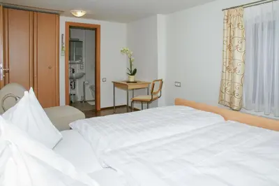 Ein Bett oder Betten in einem Zimmer der Unterkunft Gasthof Hofbauer