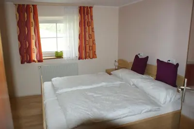 Ein Bett oder Betten in einem Zimmer der Unterkunft Schlagerberg