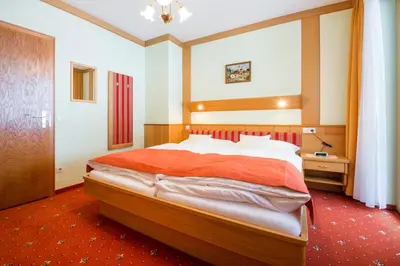 Ein Bett oder Betten in einem Zimmer der Unterkunft Frühstückspension Rötelstein